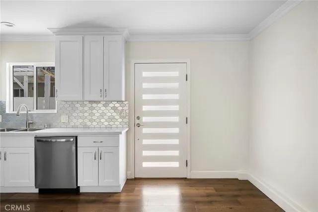 a view of cabinets and wooden floor