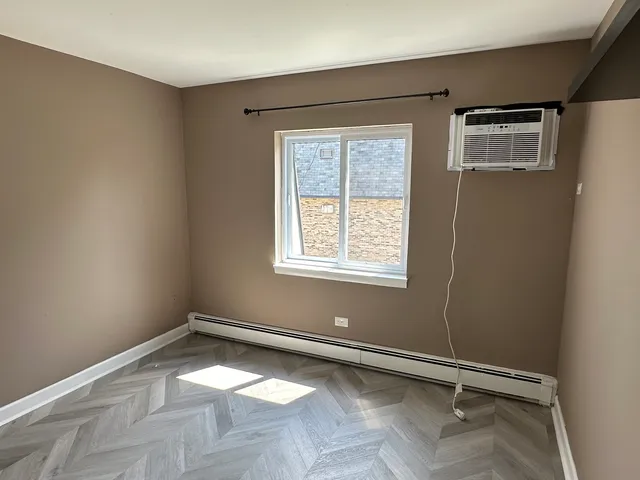 wooden floor and window in a room