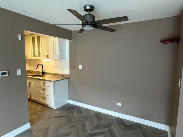 a bathroom with a sink vanity and a mirror