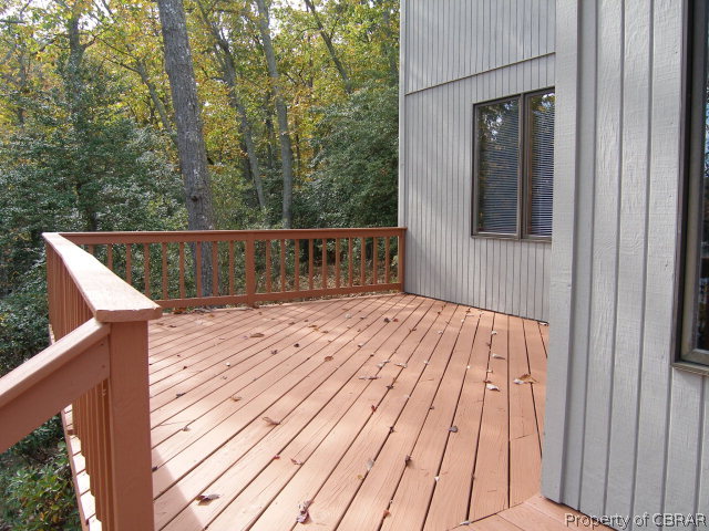 879 West Point Road Lancaster, VA 22503 - Photo 15 of 38 a view of balcony with wooden floor and outdoor space