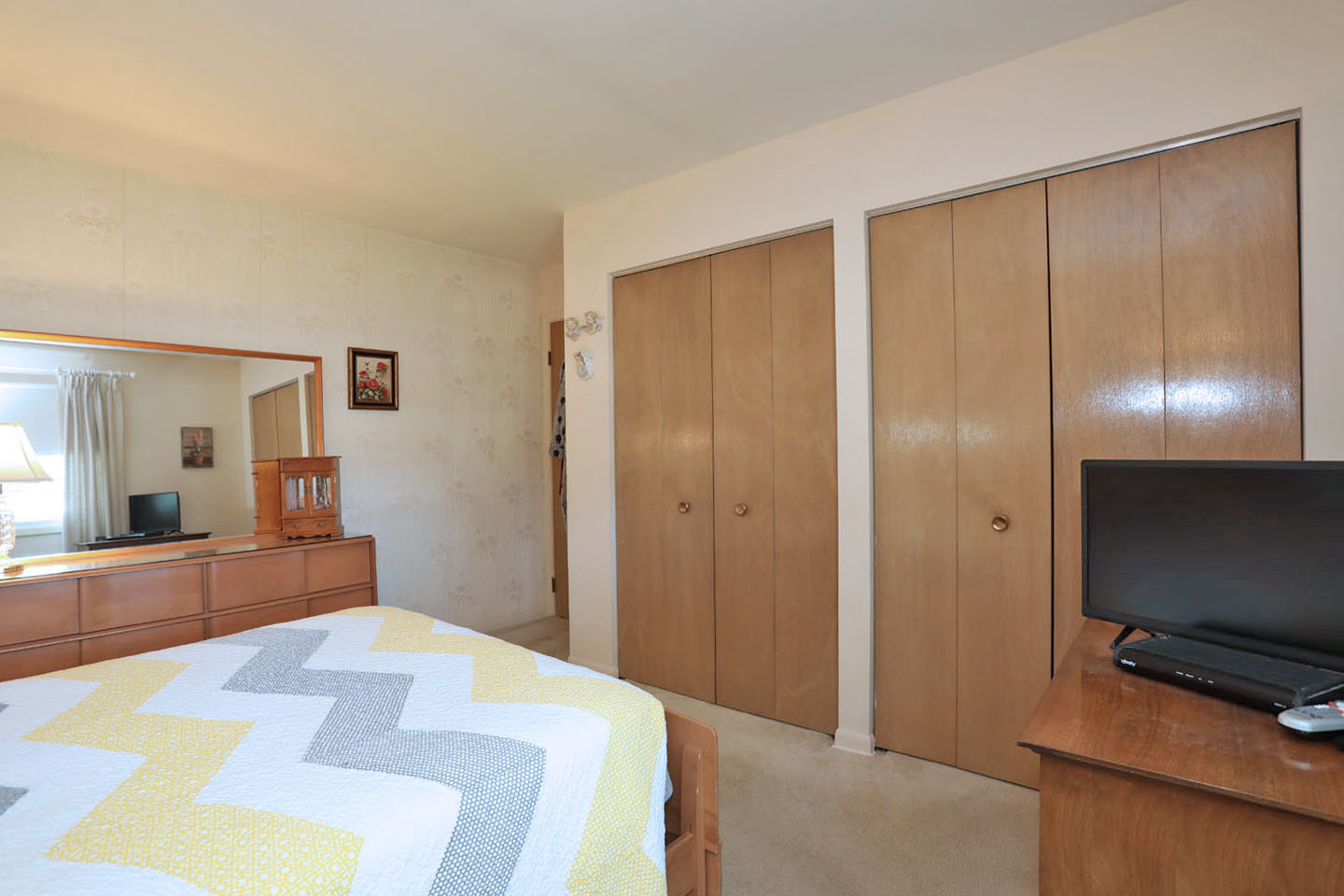 645 South Ardmore Avenue Addison, IL 60101 - Photo 12 of 28 a bedroom with a bed and a flat screen tv