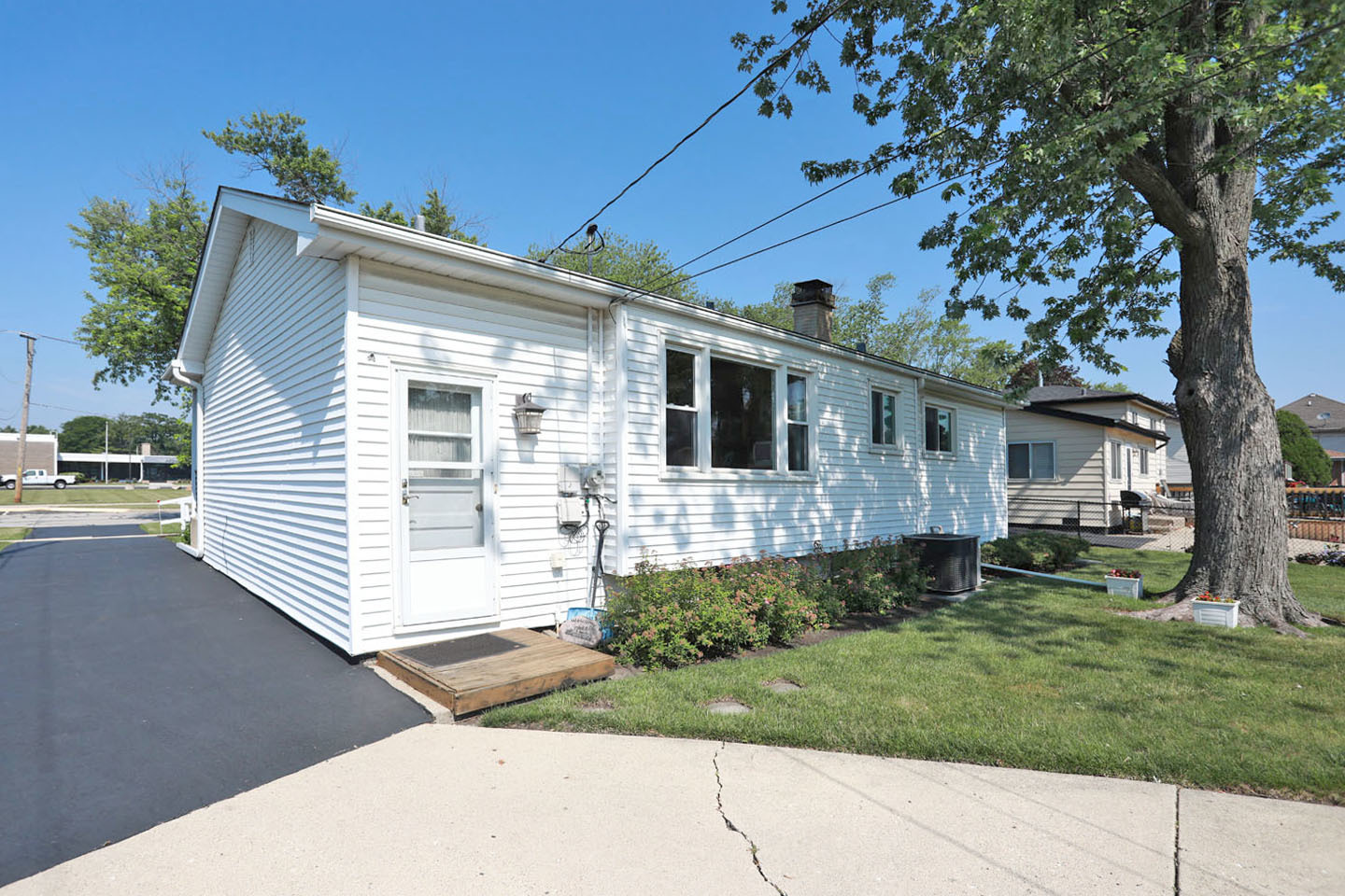 645 South Ardmore Avenue Addison, IL 60101 - Photo 23 of 28 a front view of a house with a yard