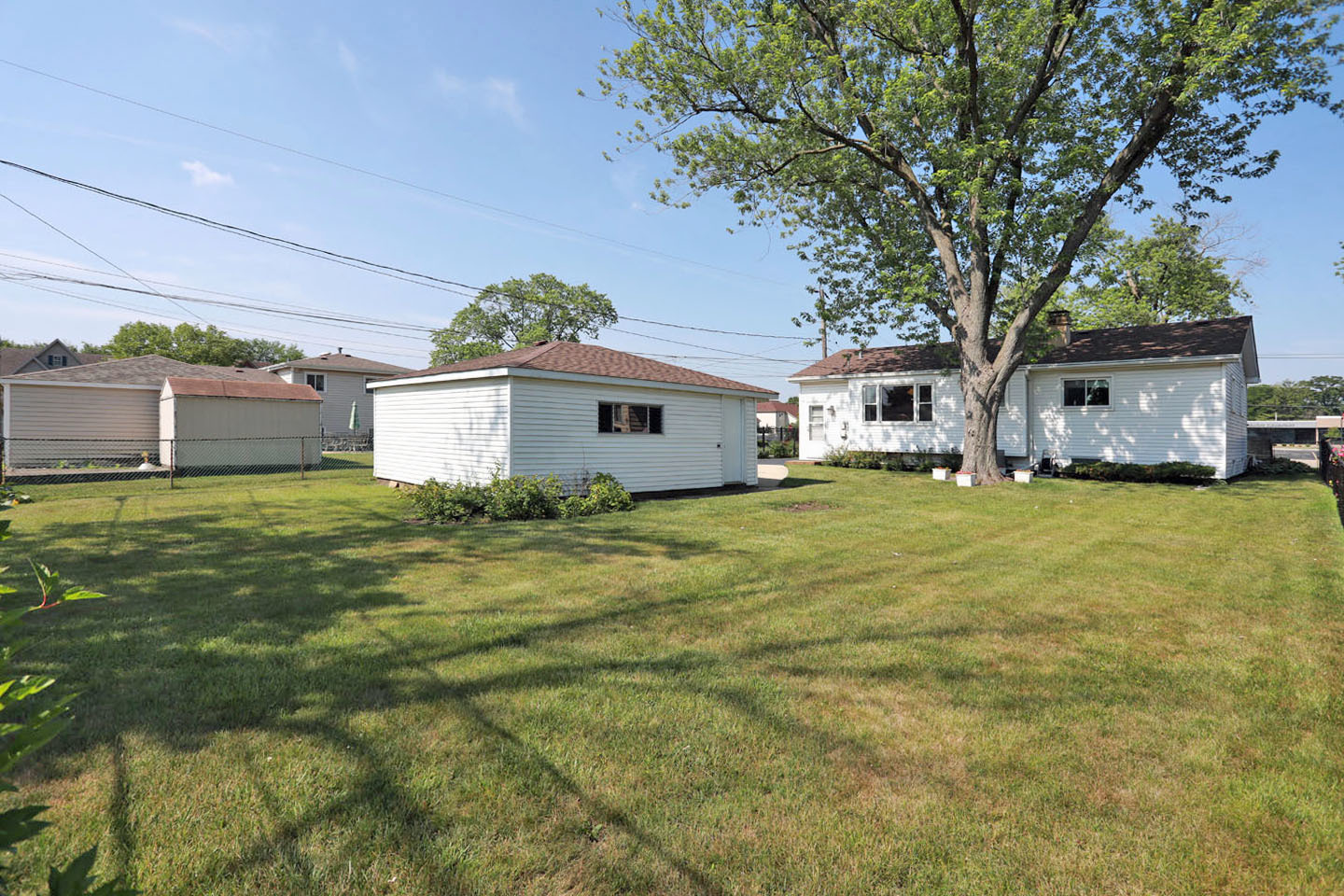 645 South Ardmore Avenue Addison, IL 60101 - Photo 27 of 28 a house that has a tree in front of it