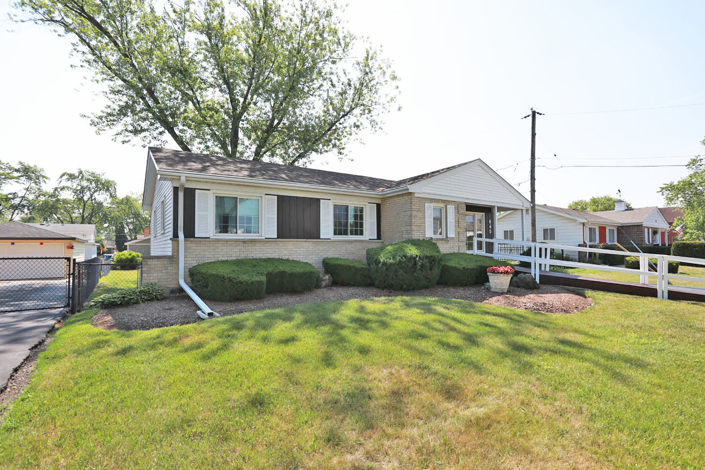 645 South Ardmore Avenue Addison, IL 60101 - Photo 3 of 28 a view of a house with backyard porch and sitting area