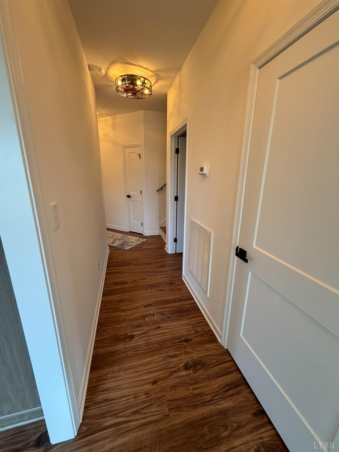405 Hixburg Road Pamplin, VA 23958 - Photo 42 of 73 a view of a hallway with wooden floor and staircase