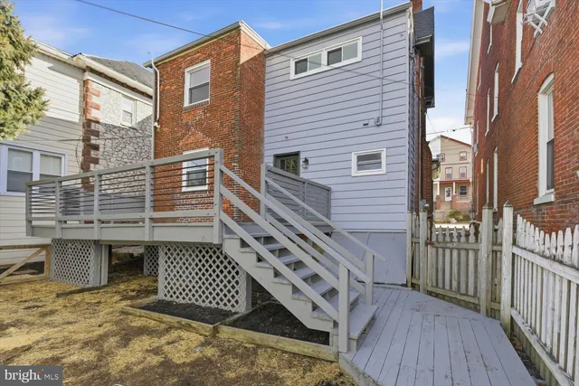 a view of a wooden door of the house