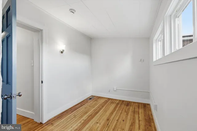 a view of a room with wooden floor and small space