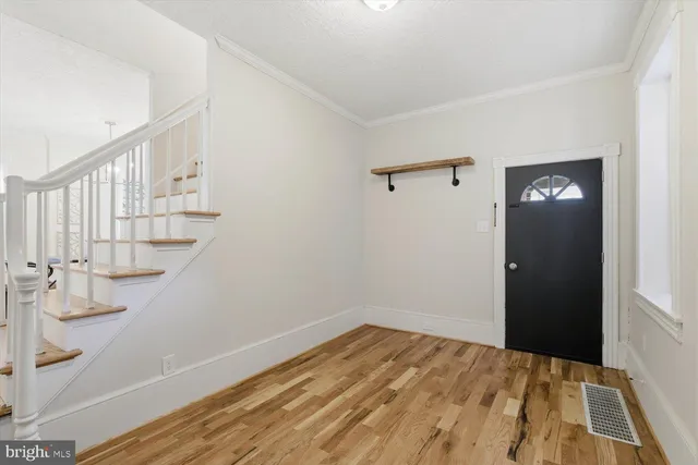 a view of empty room with stairs