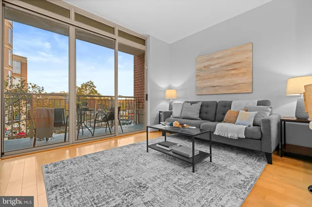 a living room with furniture and a rug