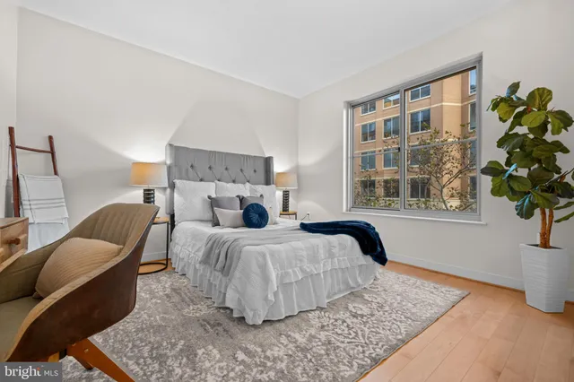 a bedroom with a bed and a fireplace