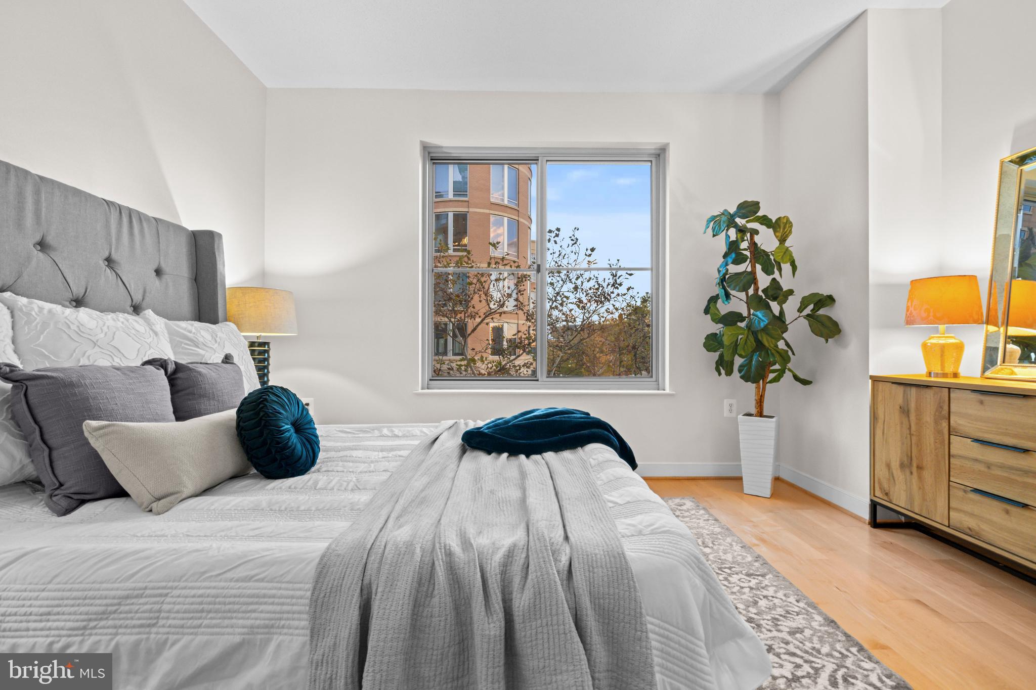 820 North Pollard Street, Unit 307 Arlington, VA 22203 - Photo 17 of 29 a bedroom with a bed and a window