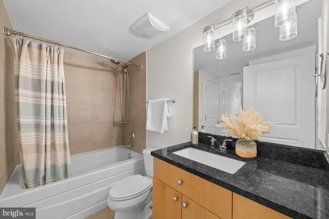 a bathroom with a bathtub and shower