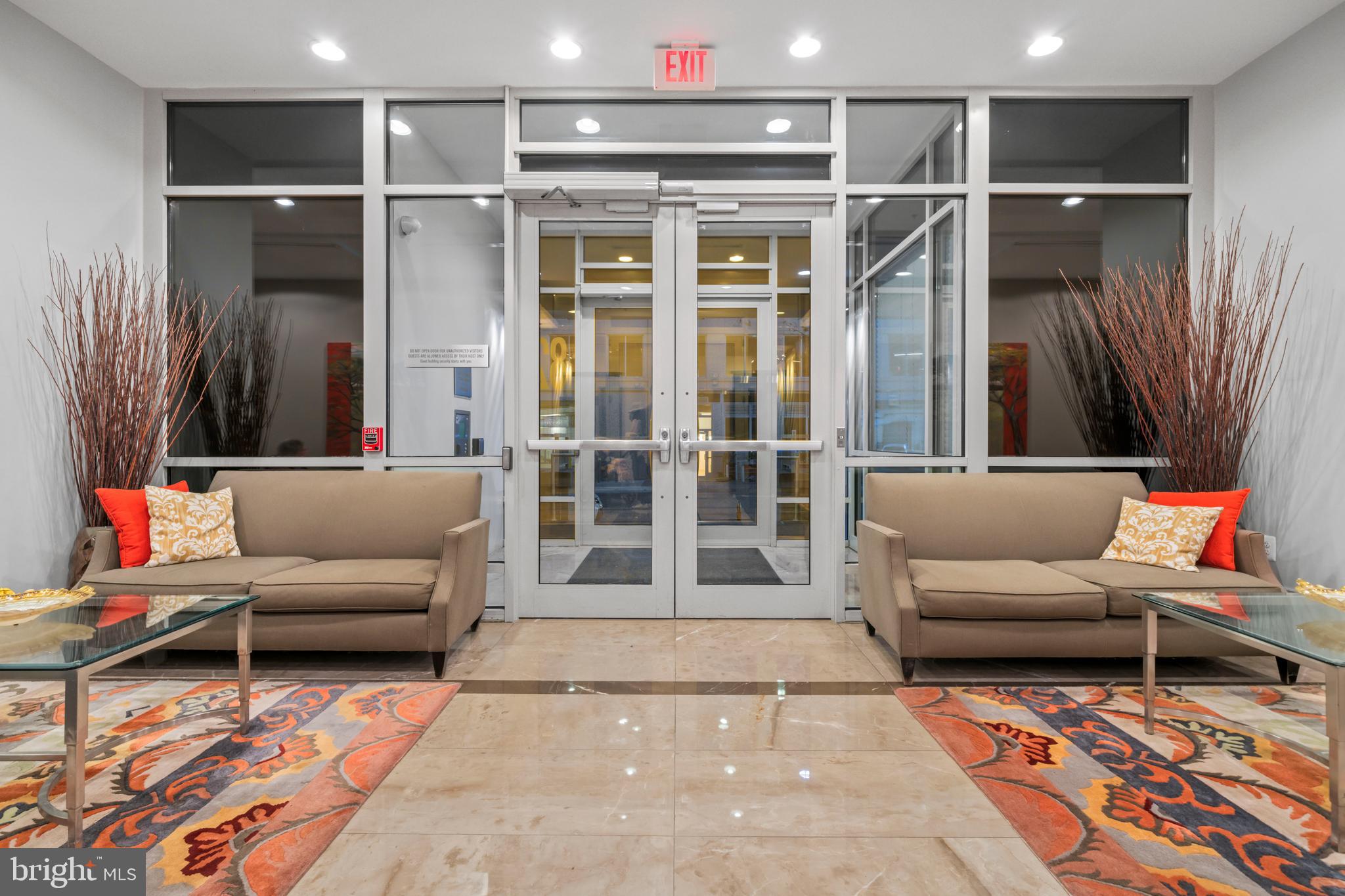 820 North Pollard Street, Unit 307 Arlington, VA 22203 - Photo 24 of 29 a living room with furniture and a rug