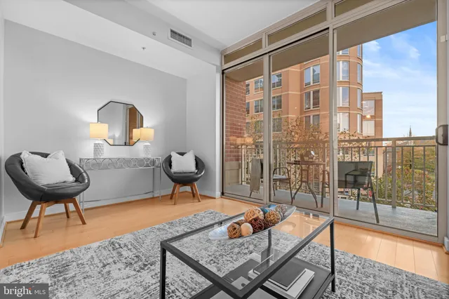 a living room with furniture and a rug