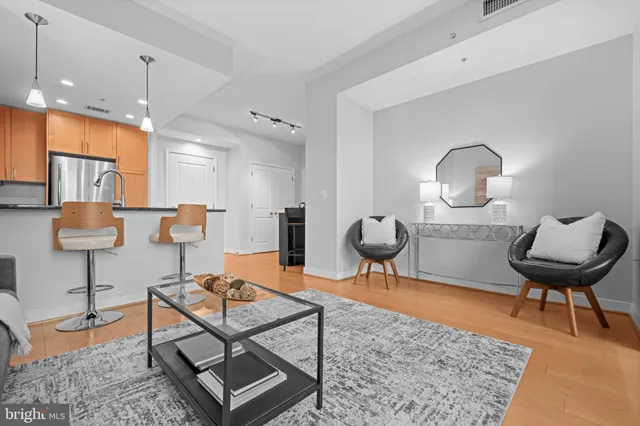 a living room with furniture and a rug