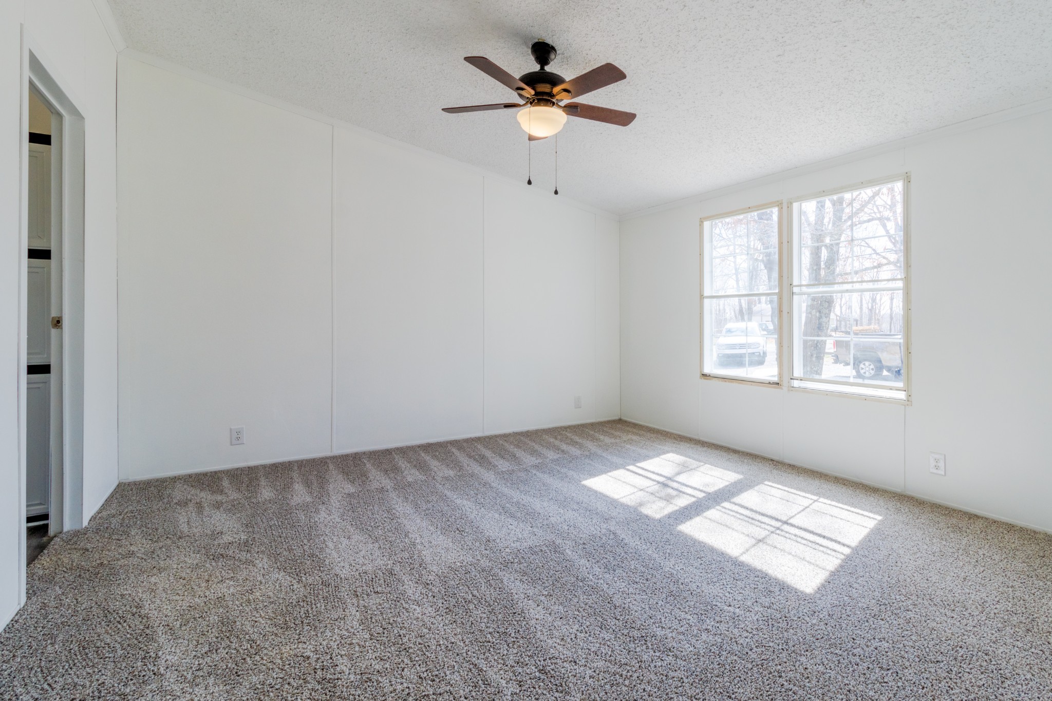 1835 Jim Kim Road Palmyra, TN 37142 - Photo 13 of 36 an empty room with windows and fan
