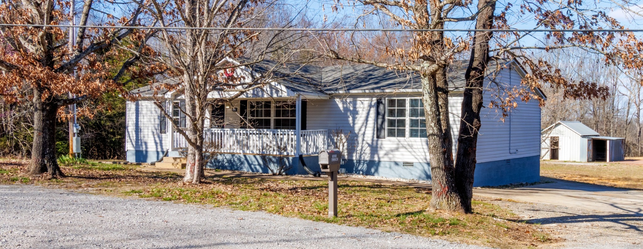 1835 Jim Kim Road Palmyra, TN 37142 - Photo 2 of 36 a view of a house with snow on the road