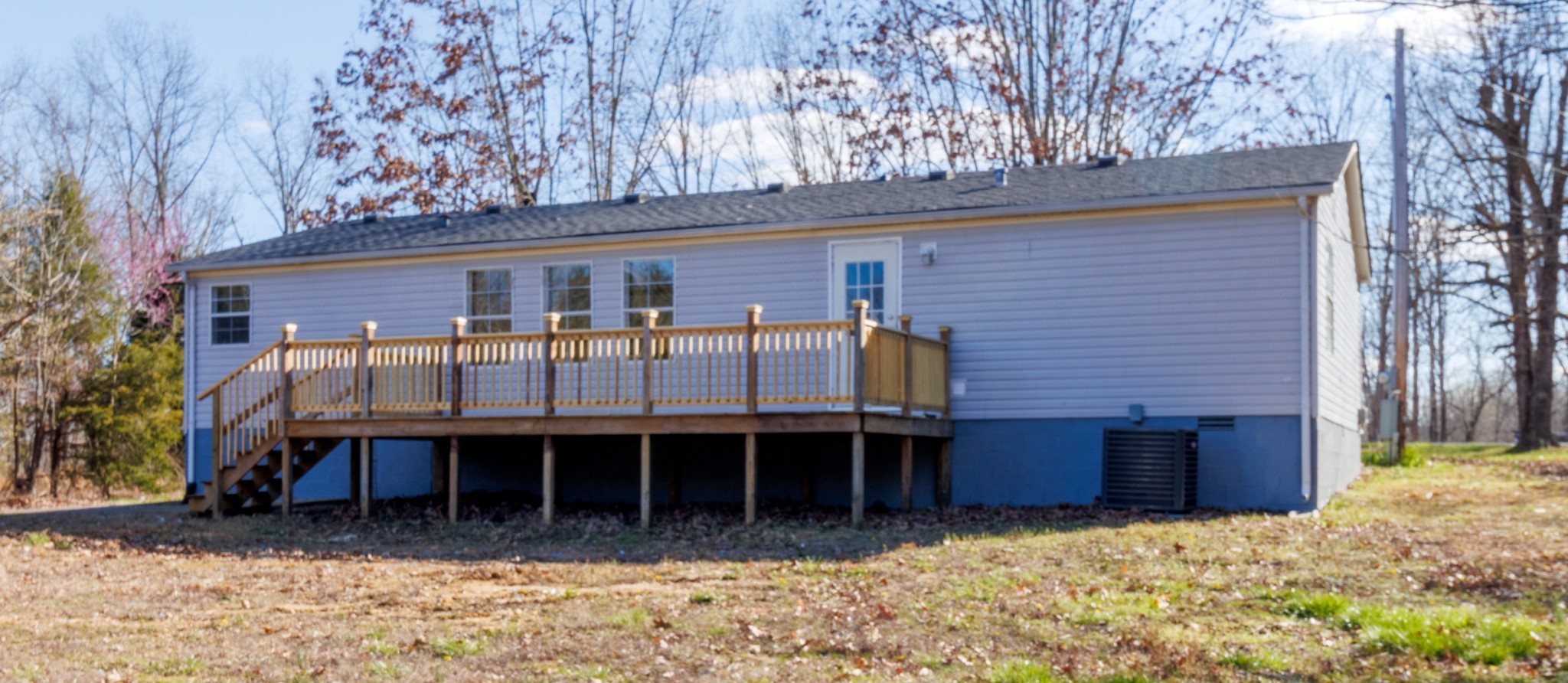 1835 Jim Kim Road Palmyra, TN 37142 - Photo 31 of 36 front view of a house with a large window and a yard