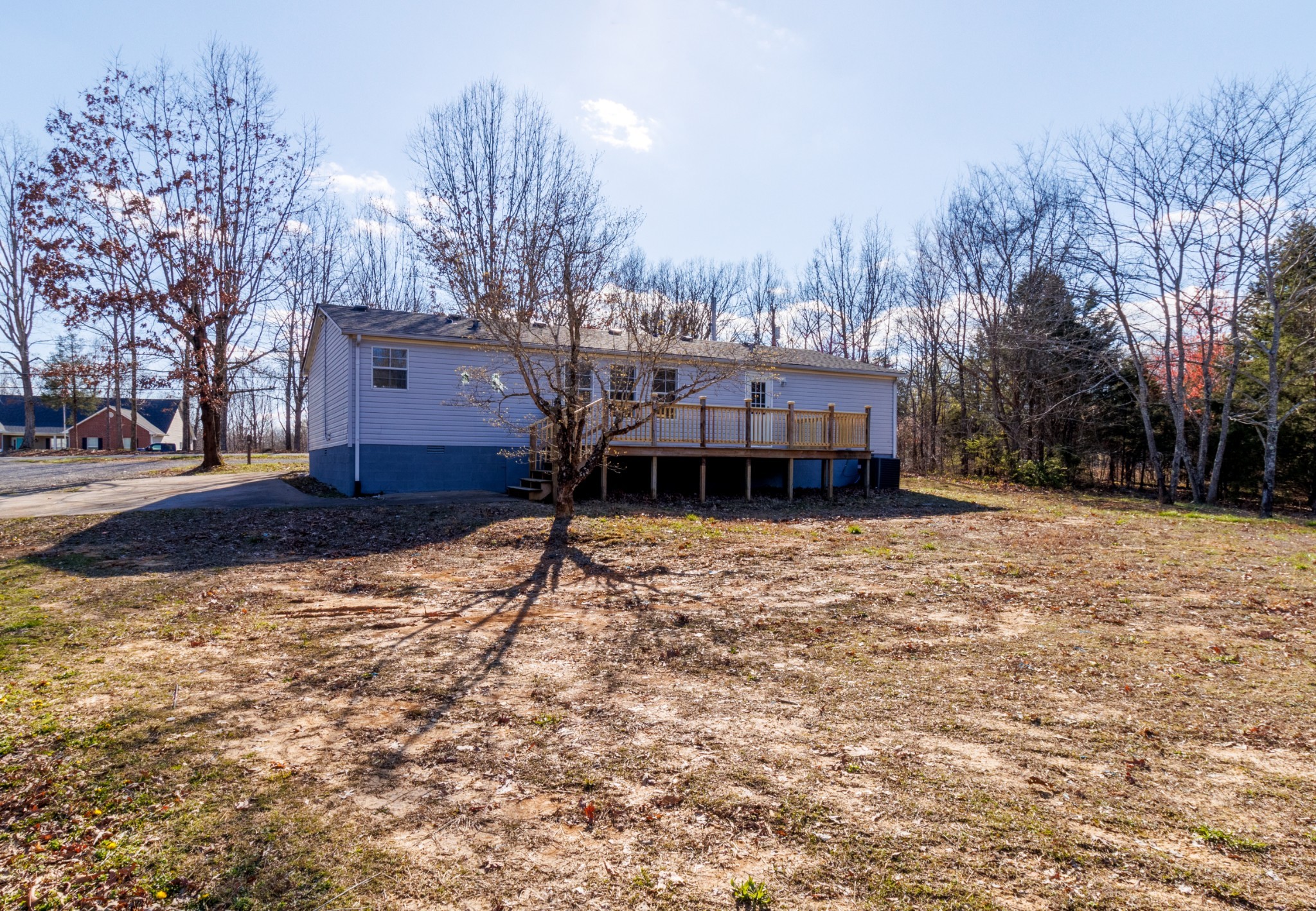 1835 Jim Kim Road Palmyra, TN 37142 - Photo 35 of 36 a house with trees in front of it