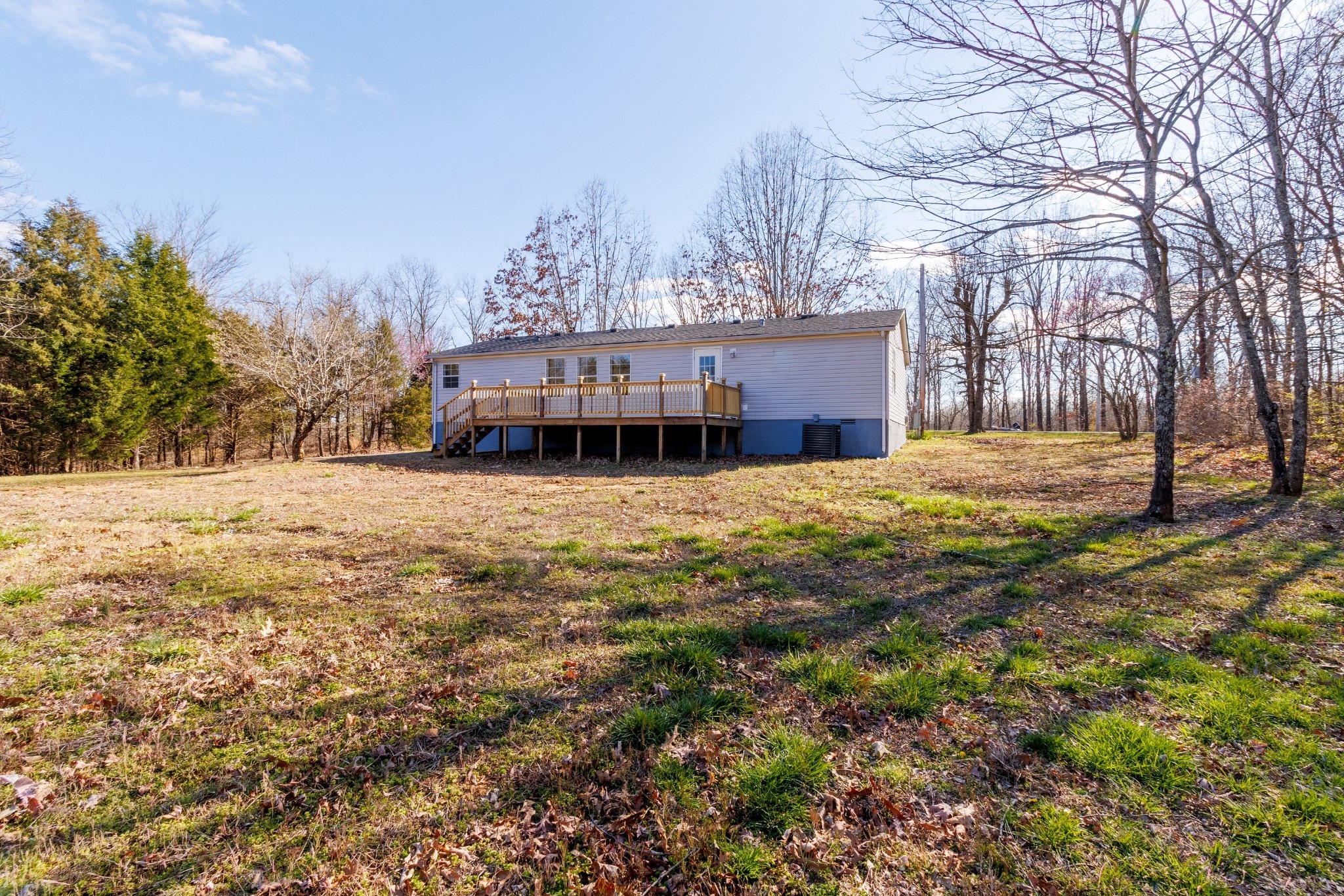 1835 Jim Kim Road Palmyra, TN 37142 - Photo 36 of 36 a view of a house with a yard covered in snow