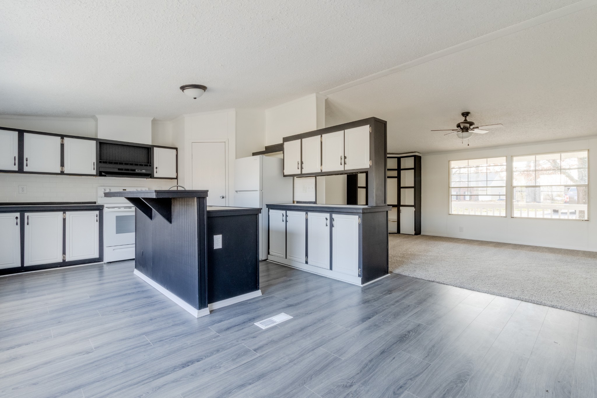 1835 Jim Kim Road Palmyra, TN 37142 - Photo 8 of 36 a kitchen with stainless steel appliances a refrigerator and wooden floor