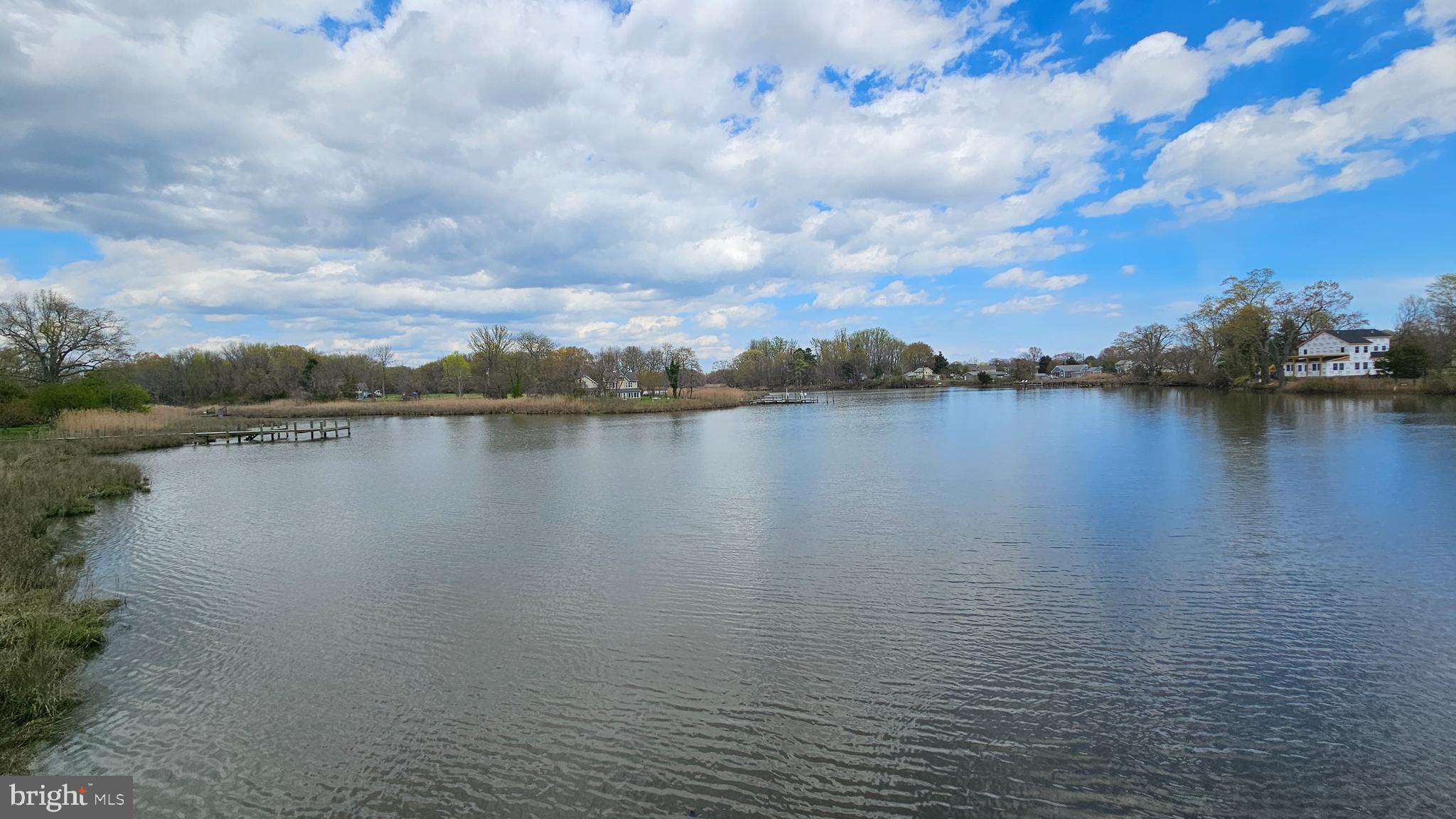 6107 Traceys Overlook Road Tracys Landing, MD 20779 - Photo 60 of 67 a view of a lake with houses in the back