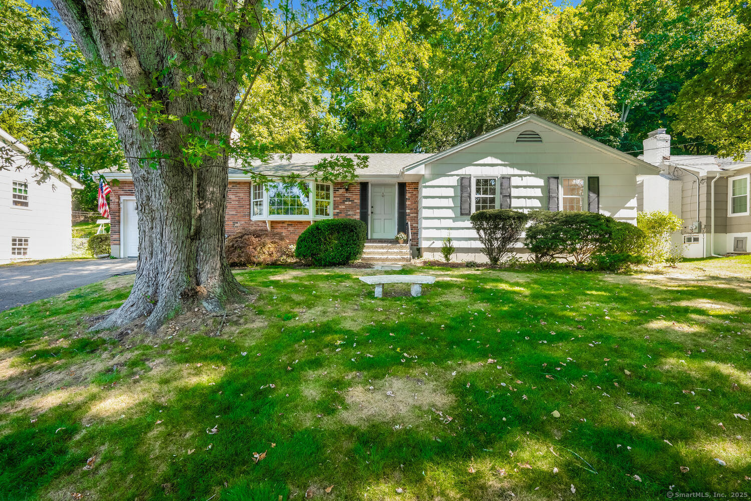276 Carroll Road Fairfield, CT 06824 - Photo 1 of 1 a front view of a house with a yard