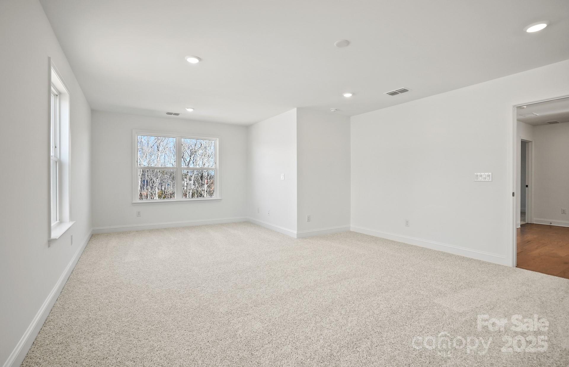 2234 Millenium Drive, Unit 84 Lancaster, SC 29720 - Photo 31 of 37 an empty room with windows