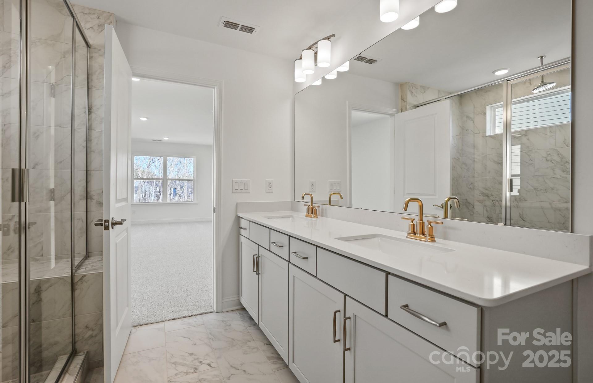 2234 Millenium Drive, Unit 84 Lancaster, SC 29720 - Photo 33 of 37 a bathroom with a sink double vanity and a mirror
