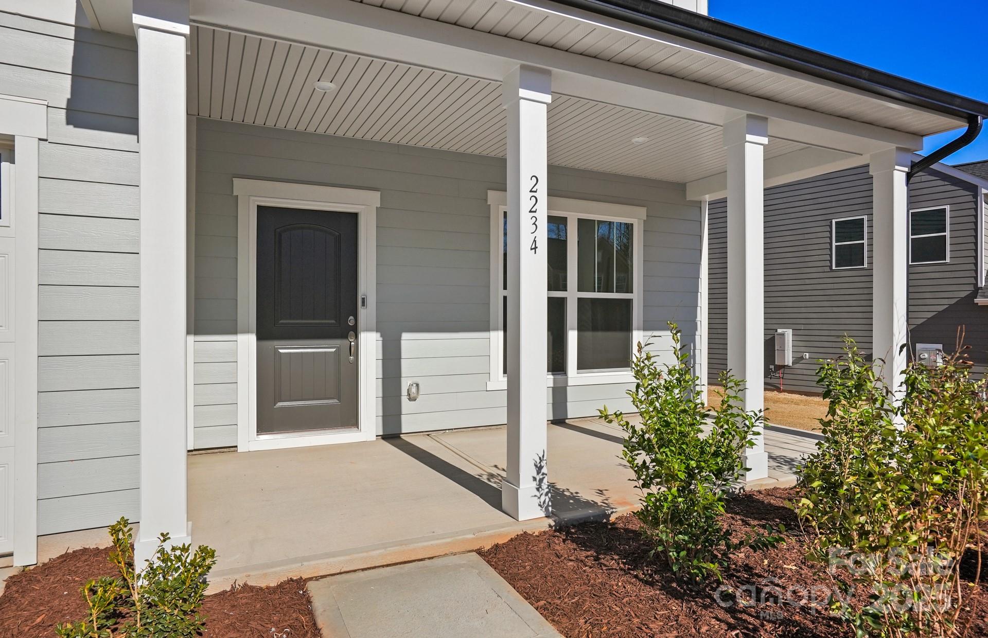 2234 Millenium Drive, Unit 84 Lancaster, SC 29720 - Photo 4 of 37 front view of a house with a glass door