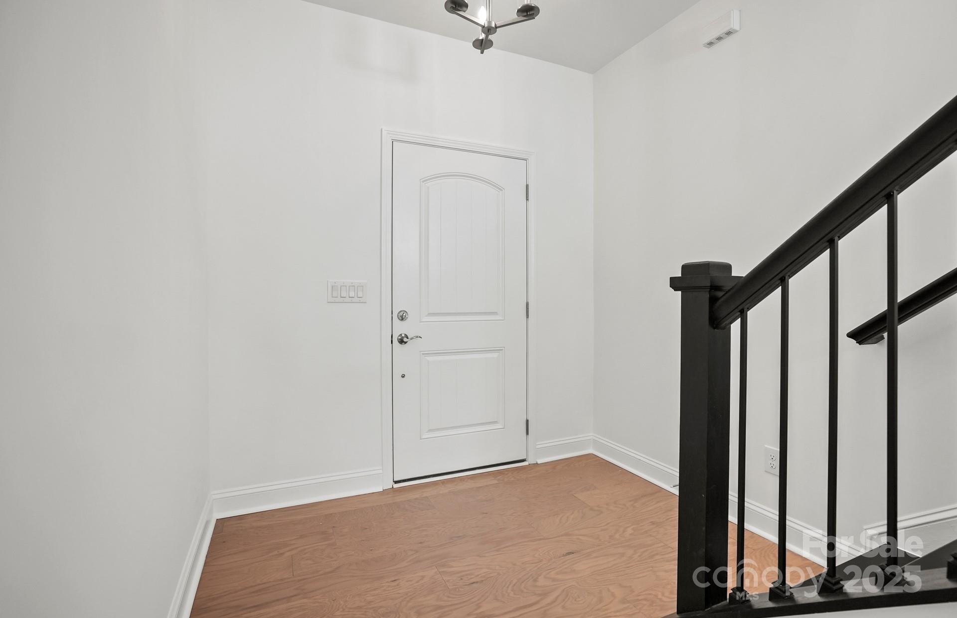 2234 Millenium Drive, Unit 84 Lancaster, SC 29720 - Photo 5 of 37 a view of a room with wooden floor and stairs