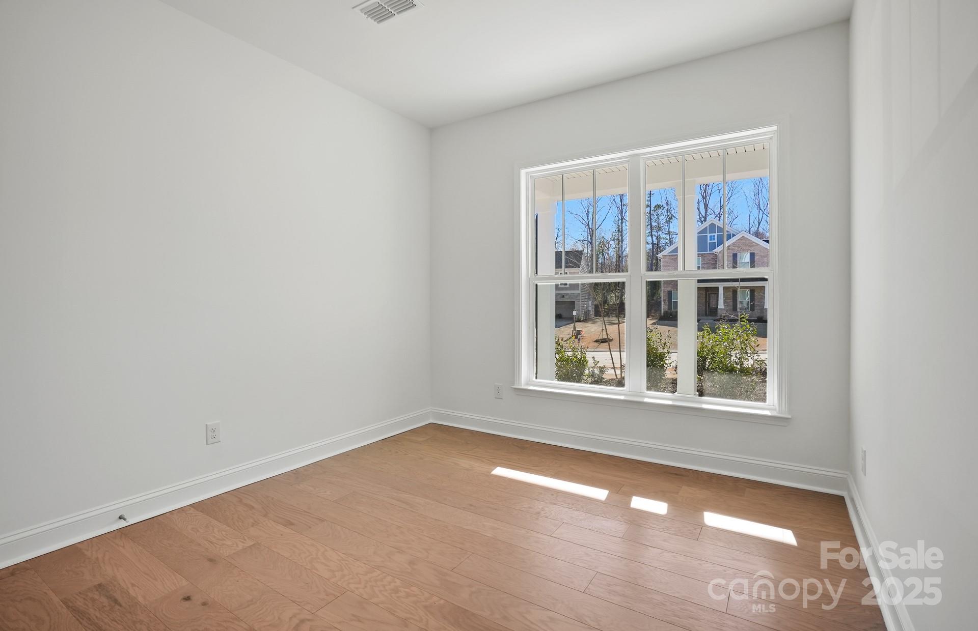 2234 Millenium Drive, Unit 84 Lancaster, SC 29720 - Photo 6 of 37 an empty room with a window