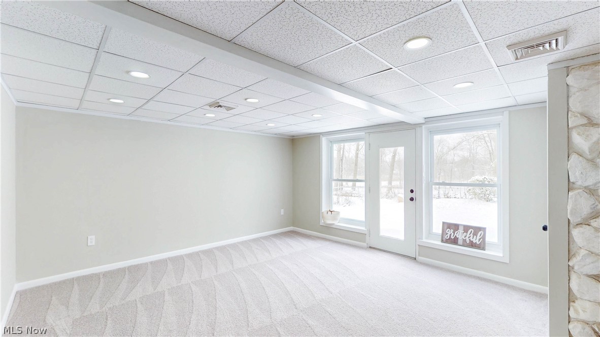 3312 Bancroft Road Akron, OH 44333 - Photo 37 of 50 Spare room with light carpet, a drop ceiling, and recessed lighting