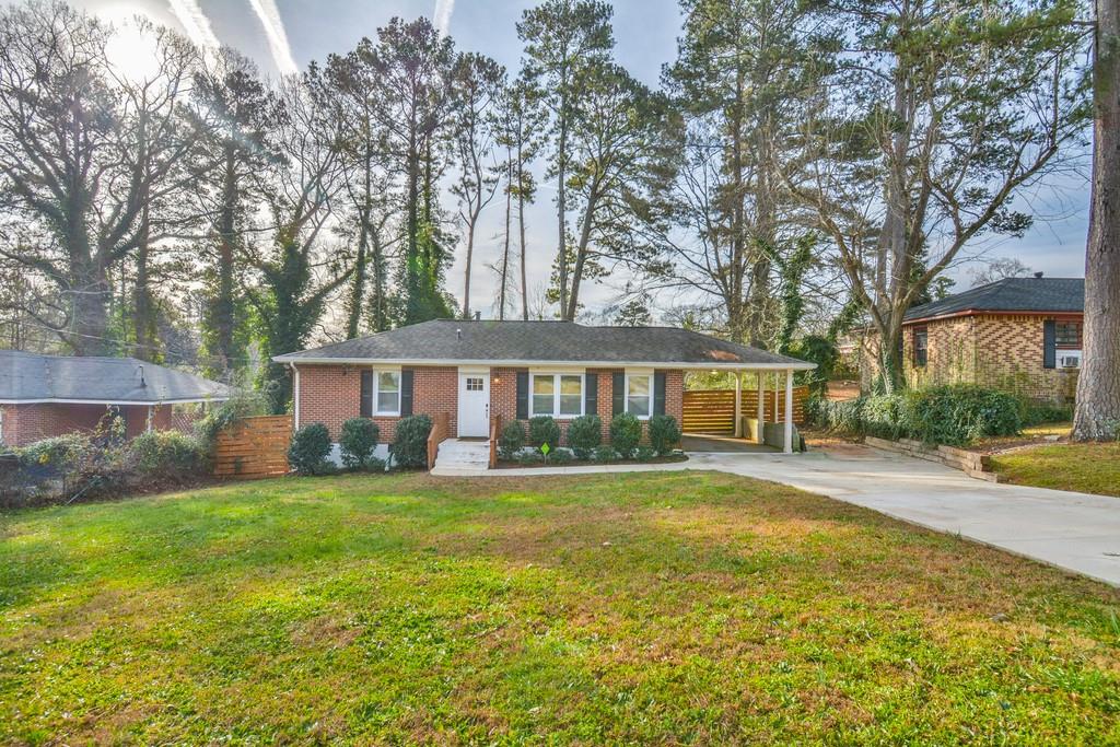2473 Habersham Drive Decatur, GA 30032 - Photo 1 of 1 a front view of a house with a yard and trees