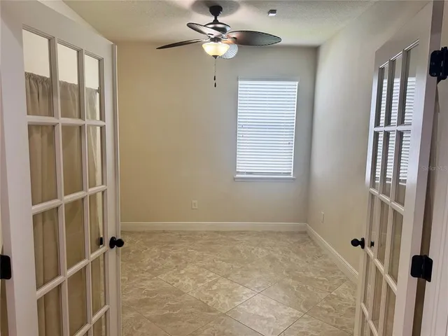 a view of an empty room with a window