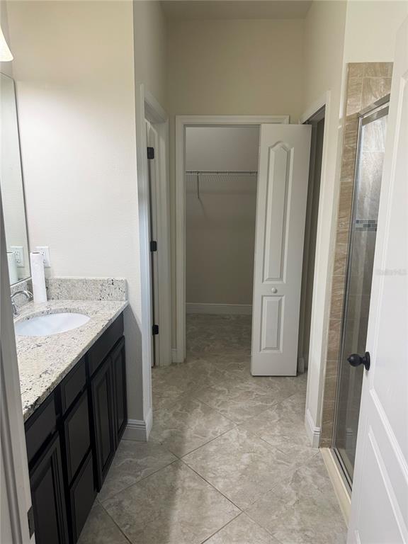 5082 Inshore Landing Drive Apollo Beach, FL 33572 - Photo 21 of 48 a bathroom with a granite countertop sink and a mirror