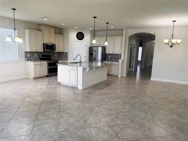 a large kitchen with cabinets