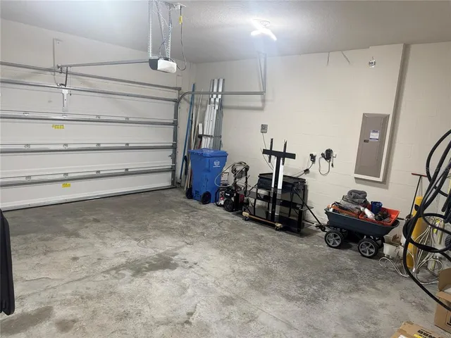 a view of room with air conditioner duct and materials on floor