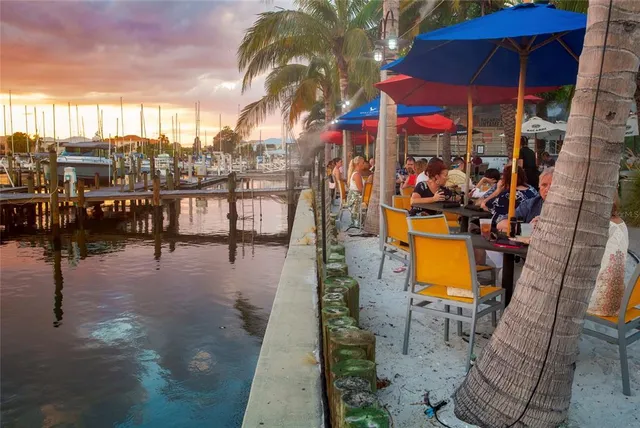 a view of a balcony with wooden benches
