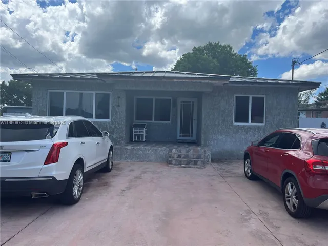 a view of a car in front of house