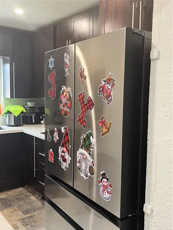 a bedroom with a bed a chair and potted plant
