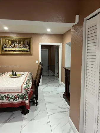 a bedroom with a bed and a flat tv screen