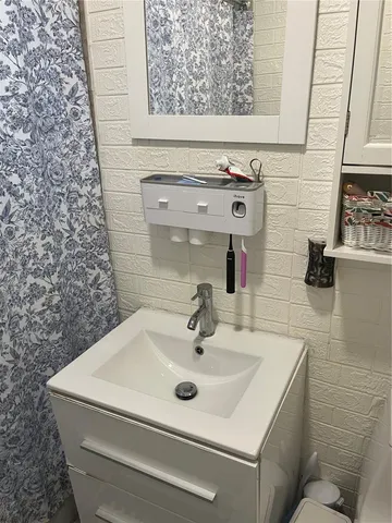 a bedroom with a bed and a mirror