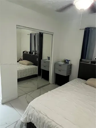 a bathroom with a shower curtain and a window