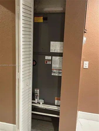 a bedroom with a bed and mirror