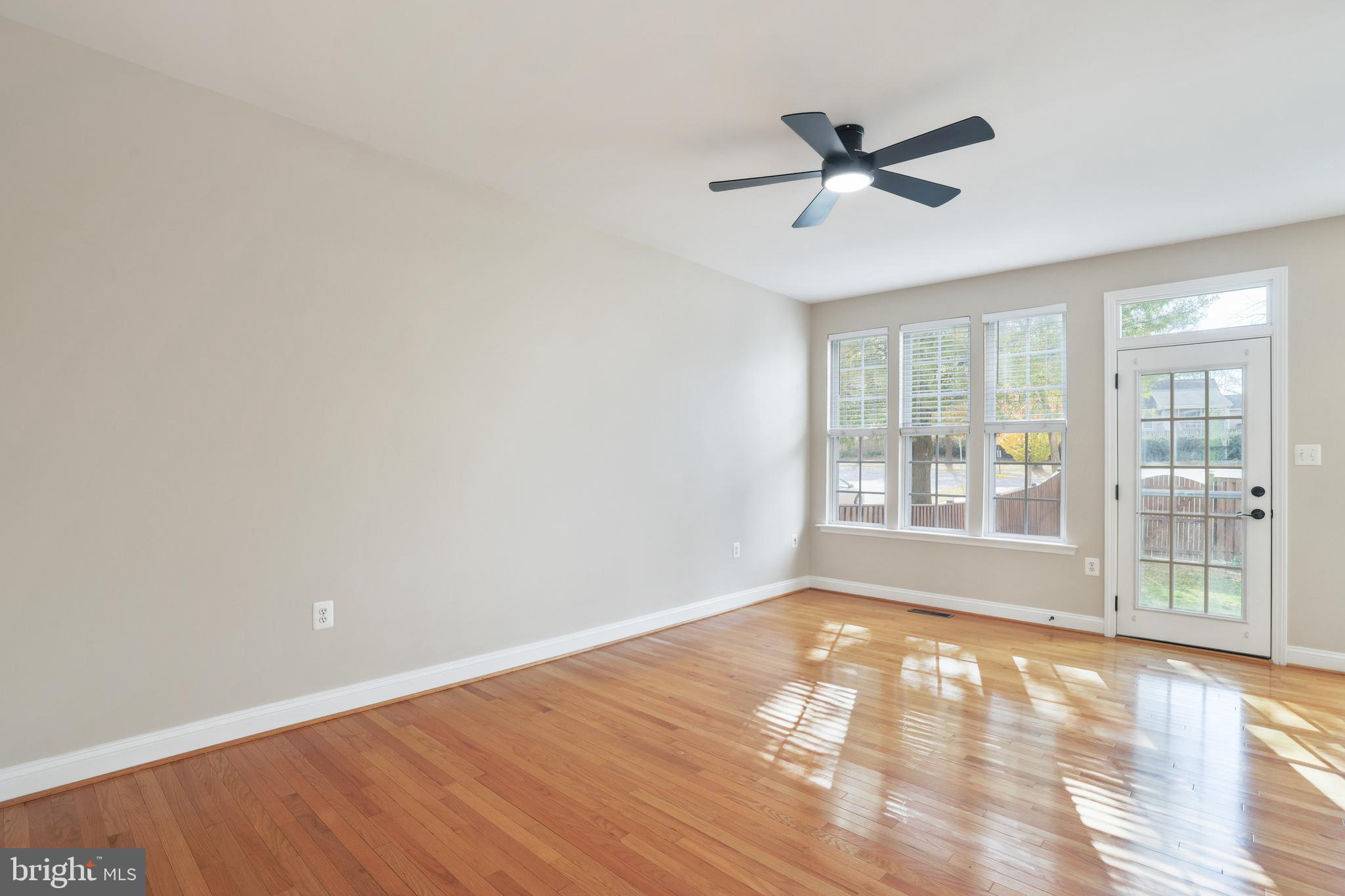 401 Yorkshire Ridge Court Purcellville, VA 20132 - Photo 15 of 64 a view of an empty room with wooden floor and a window