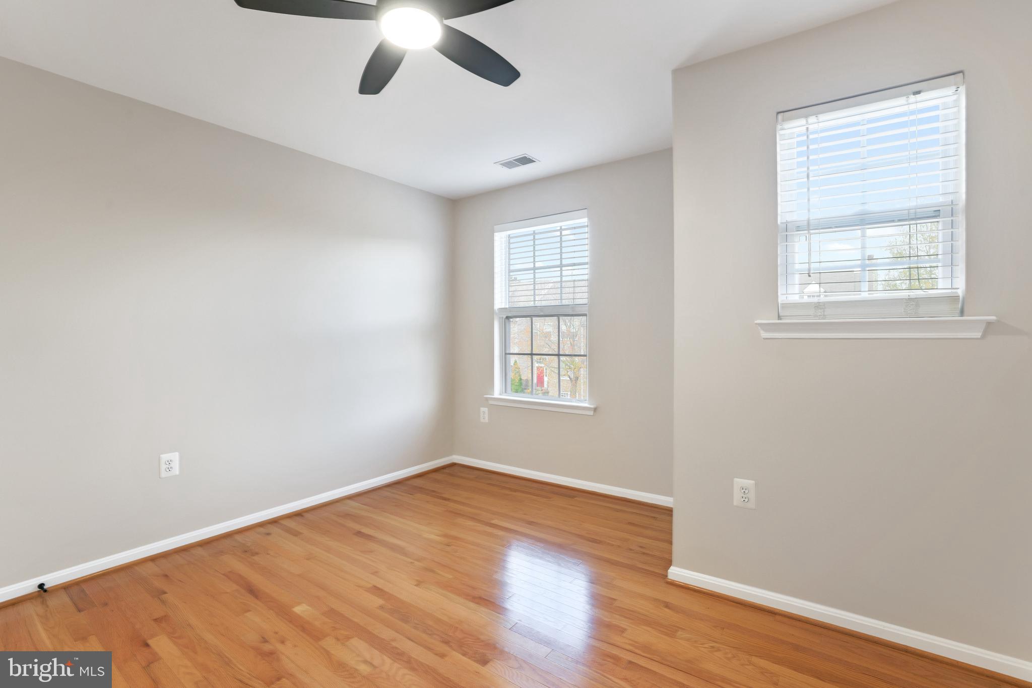 401 Yorkshire Ridge Court Purcellville, VA 20132 - Photo 41 of 64 a view of empty room with wooden floor and fan