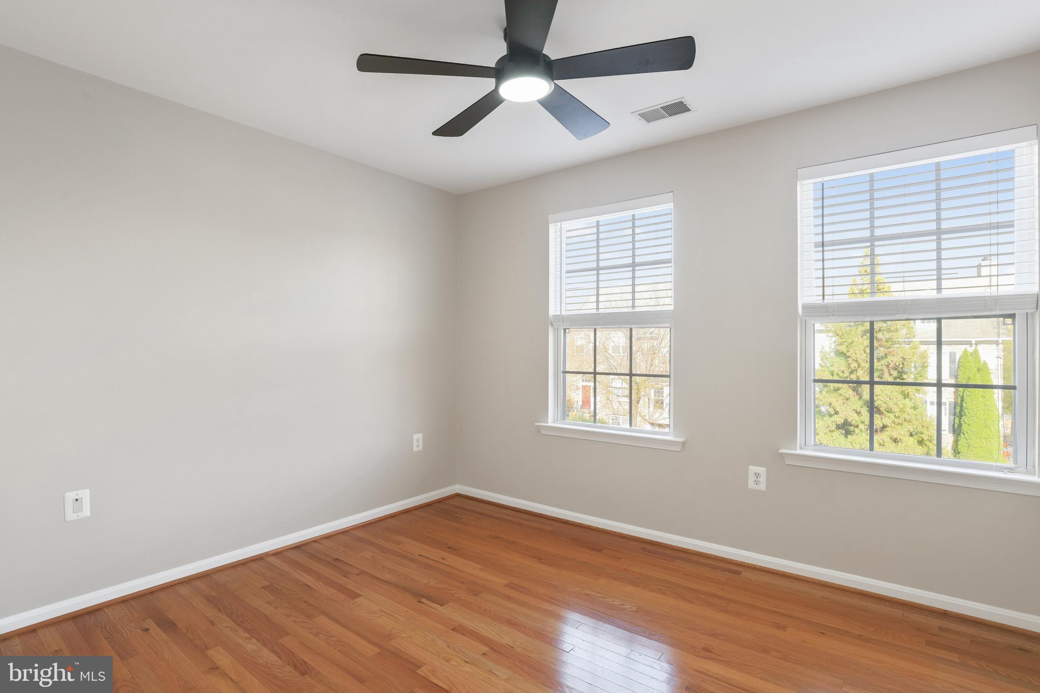 401 Yorkshire Ridge Court Purcellville, VA 20132 - Photo 42 of 64 a view of an empty room with wooden floor and a window