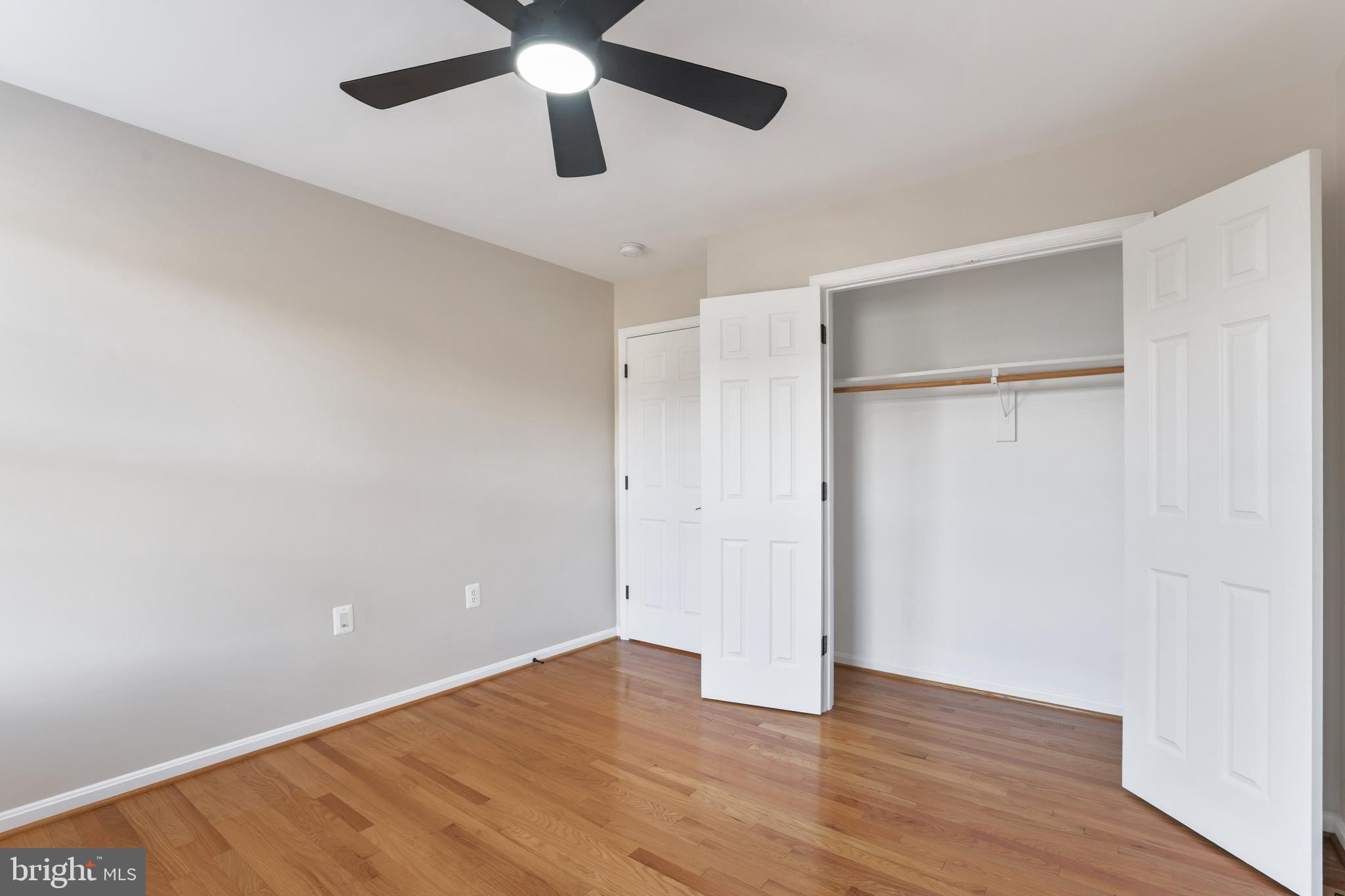 401 Yorkshire Ridge Court Purcellville, VA 20132 - Photo 44 of 64 an empty room with wooden floor a ceiling fan and closet