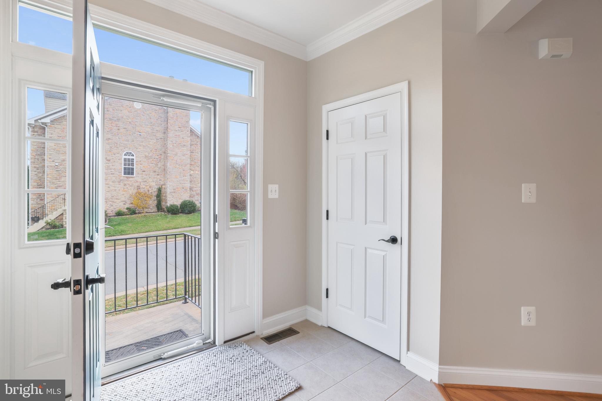 401 Yorkshire Ridge Court Purcellville, VA 20132 - Photo 5 of 64 a view of a balcony with a glass door